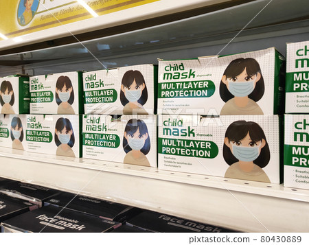PENANG, MALAYSIA -JULY 21, 2020: Selective focused on disposable face masks are on display for sale in supermarkets. Sorted by brand and type. Comes in a variety of colors and patterns. 80430889
