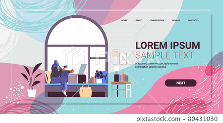 arab woman with credit card using laptop online shopping concept living room interior horizontal 80431030