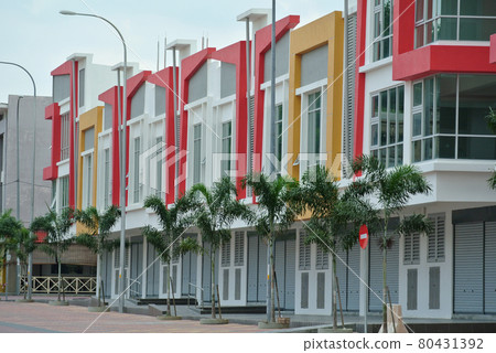 KUALA LUMPUR, MALAYSIA -NOVEMBER 11, 2016: Row of two storey colorful commercial shop lot facade in Kuala Lumpur, Malaysia. KUALA LUMPUR, MALAYSIA -NOVEMBER 11, 2016: Row of two storey colorful commercial shop lot facade in Kuala Lumpur, Malaysia. 80431392