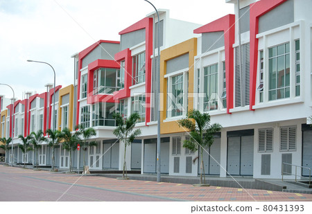 KUALA LUMPUR, MALAYSIA -NOVEMBER 11, 2016: Row of two storey colorful commercial shop lot facade in Kuala Lumpur, Malaysia. KUALA LUMPUR, MALAYSIA -NOVEMBER 11, 2016: Row of two storey colorful commercial shop lot facade in Kuala Lumpur, Malaysia. 80431393