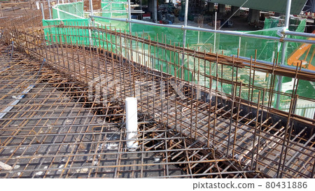 KUALA LUMPUR, MALAYSIA -NOVEMBER 23, 2020: Building floor slab under construction. Construction workers fabricating the timber formwork and installing the steel reinforcement bar. KUALA LUMPUR, MALAYSIA -NOVEMBER 23, 2020: Building floor slab under construction. Construction workers fabricating the timber formwork and installing the steel reinforcement bar. 80431886