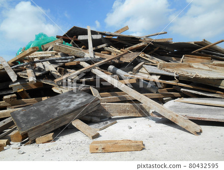 MALACCA, MALAYSIA -DECEMBER 06, 2016: A pile of construction waste. Most of it is the old and broken timber form work. MALACCA, MALAYSIA -DECEMBER 06, 2016: A pile of construction waste. Most of it is the old and broken timber form work. 80432595