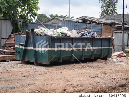 SELANGOR, MALAYSIA -OCTOBER 18, 2016: Construction wasted disposal bin at the construction site. Construction waste was collected here before remove from site. SELANGOR, MALAYSIA -OCTOBER 18, 2016: Construction wasted disposal bin at the construction site. Construction waste was collected here before remove from site. 80432608