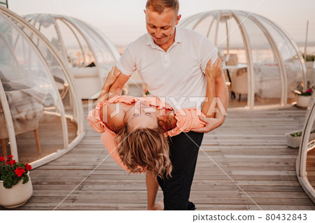 a man and a woman in love dance to a rooftop cafe on a date. a man and a woman in love dance to a rooftop cafe on a date. 80432843