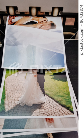 top view. printing of wedding photos in the photo laboratory.  80432874