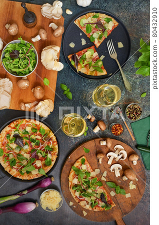 Table with Glasses With White Wine and Pizza 80432910