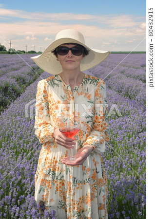 Woman with Rose Wine In Lavender Field Woman with Rose Wine In Lavender Field 80432915