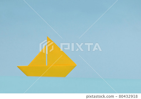 Yellow Paper boat On Blue Background Yellow Paper boat On Blue Background 80432918