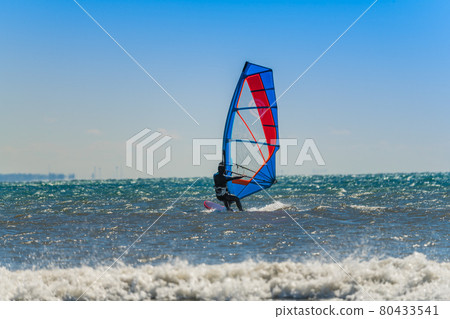 [Windsurfing in the spring storm with white waves] 80433541