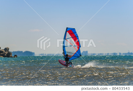 [Windsurfing in the spring storm with white waves] 80433543