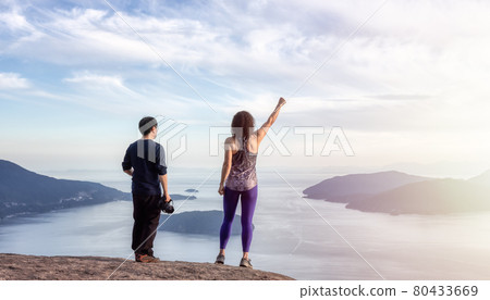 Friends hiking on top of Canadian Mountain Landscape 80433669