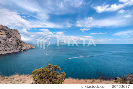 Magnificent blue sea and mountains background Magnificent blue sea and mountains background 80433687