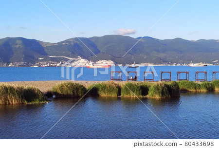 Magnificent blue sea and mountains background Magnificent blue sea and mountains background 80433698