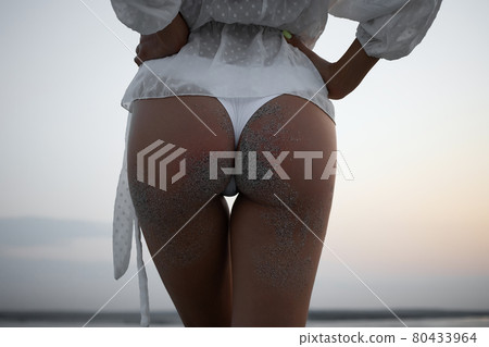 Alluring buttocks of woman in bikini 80433964
