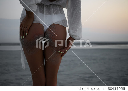 Alluring buttocks of woman in bikini Alluring buttocks of woman in bikini 80433966