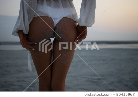 Alluring buttocks of woman in bikini 80433967