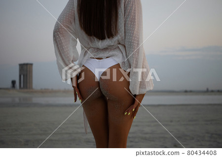 Alluring buttocks of woman in bikini 80434408