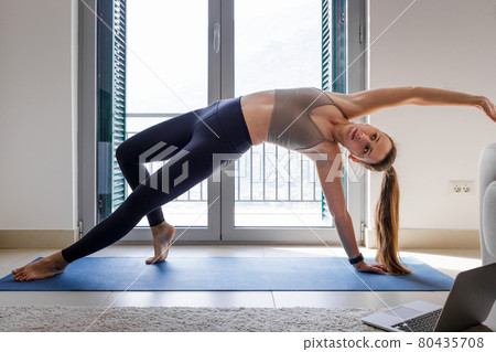 Young fitness girl doing wild thing yoga pose Young fitness girl doing wild thing yoga pose 80435708