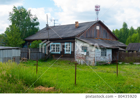 old house and fence in the village in summer 80435920