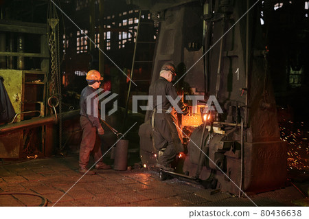 Worker controlling metal melting in furnaces Worker controlling metal melting in furnaces 80436638