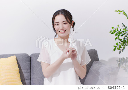 Young woman wearing a mask with a smile Young woman wearing a mask with a smile 80439241