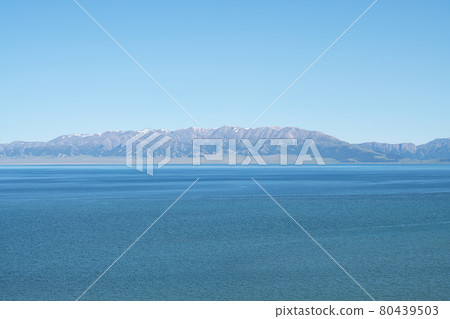 Lake and mountains in a sunny day. Shot in Sayram Lake in Xinjiang, China. 80439503