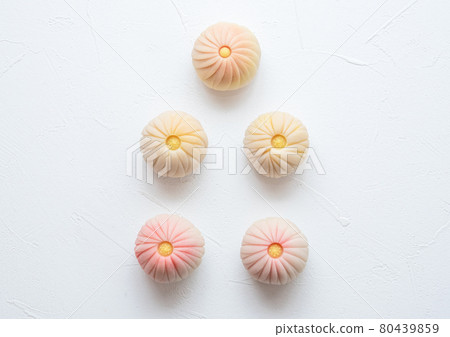 Handmade Japanese sweets on a wooden plate: Nerikiri chrysanthemum Handmade Japanese sweets on a wooden plate: Nerikiri chrysanthemum 80439859