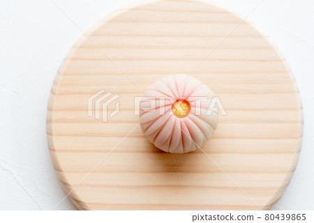 Handmade Japanese sweets on a wooden plate: Nerikiri chrysanthemum Handmade Japanese sweets on a wooden plate: Nerikiri chrysanthemum 80439865