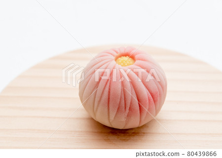 Handmade Japanese sweets on a wooden plate: Nerikiri chrysanthemum Handmade Japanese sweets on a wooden plate: Nerikiri chrysanthemum 80439866