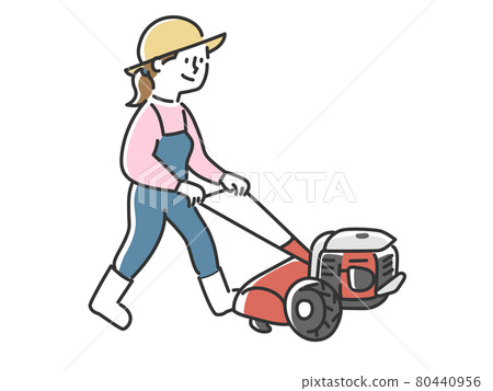 A woman who enjoys gardening by plowing a garden with a small management machine 80440956