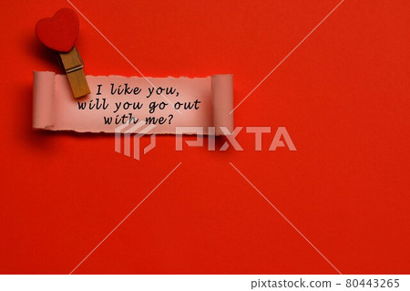 Text label on torn paper with red paper background. Valentine's Day concept Text label on torn paper with red paper background. Valentine's Day concept 80443265