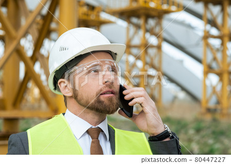 Engineer talking on the phone Engineer talking on the phone 80447227