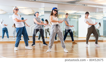 Joyous boy and girls dancing hip hop at lesson in the class 80452675