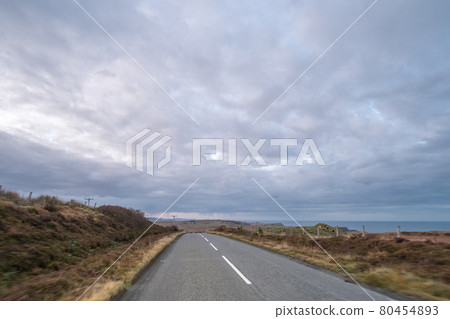 Road with Scenic Landscape View of Mountain, Forest in Scottish Highlands. Concept of Road trip, vacation. Road with Scenic Landscape View of Mountain, Forest in Scottish Highlands. Concept of Road trip, vacation. 80454893