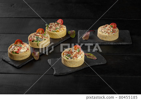 Shortbread tartlets stuffed with cream cheese and baked vegetables Shortbread tartlets stuffed with cream cheese and baked vegetables 80455185