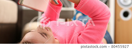 young beautiful blond woman lie on the floor read book young beautiful blond woman lie on the floor read book 80455927