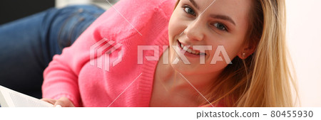 young beautiful blond woman lie on the floor read book young beautiful blond woman lie on the floor read book 80455930