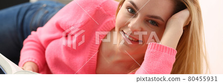 young beautiful blond woman lie on the floor read book young beautiful blond woman lie on the floor read book 80455931