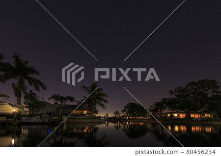 Panoramic picture of Cape Coral water channels at night 80456234