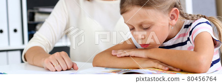Blond little reading together with mom 80456764