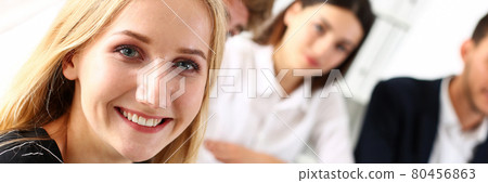 Beautiful smiling cheerful girl at workplace look in camera 80456863