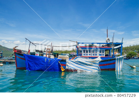 fishing boats, junks in the sea bay near the island of Vinperl fishing boats, junks in the sea bay near the island of Vinperl 80457229