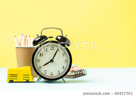 Back to school banner with black alarm clock, books and pencil. Back to school banner with black alarm clock, books and pencil. 80457301