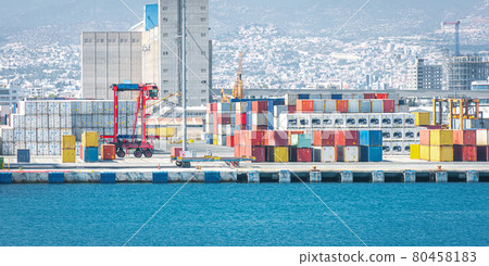 Warehouse and shipping container carriers at the port of Limassol, Cyprus Warehouse and shipping container carriers at the port of Limassol, Cyprus 80458183
