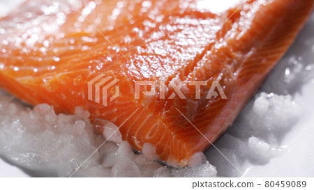 Salmon steaks and salmon fillet. Fresh salmon steaks and fillet are laid out on ice Salmon steaks and salmon fillet. Fresh salmon steaks and fillet are laid out on ice 80459089