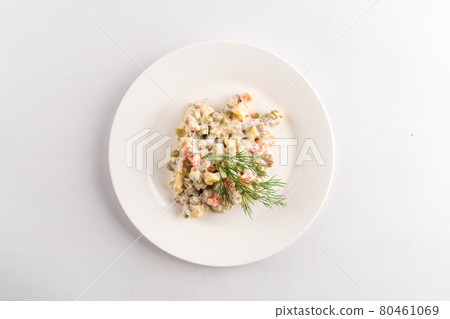 Isolated russian national olivier salad on white Isolated russian national olivier salad on white 80461069
