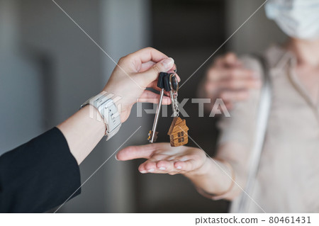 Hand Giving Keys to New House Hand Giving Keys to New House 80461431