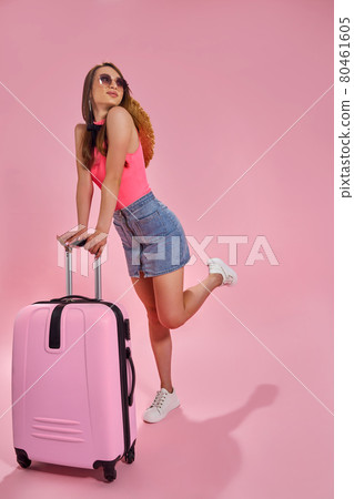 Tourist woman in summer casual clothes on pink background. 80461605