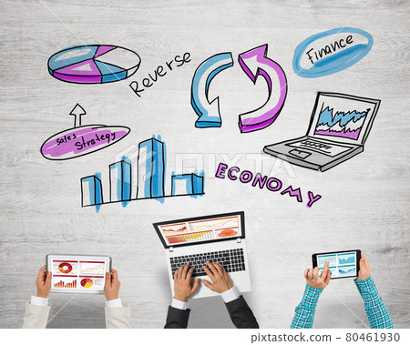 Top view of businesspeople sitting at table and using gadgets Top view of businesspeople sitting at table and using gadgets 80461930