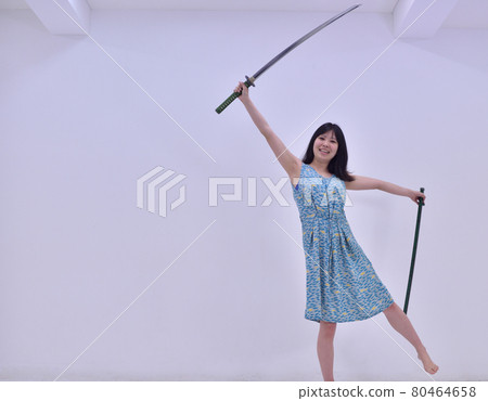 Woman playing with imitation sword 8 Woman playing with imitation sword 8 80464658